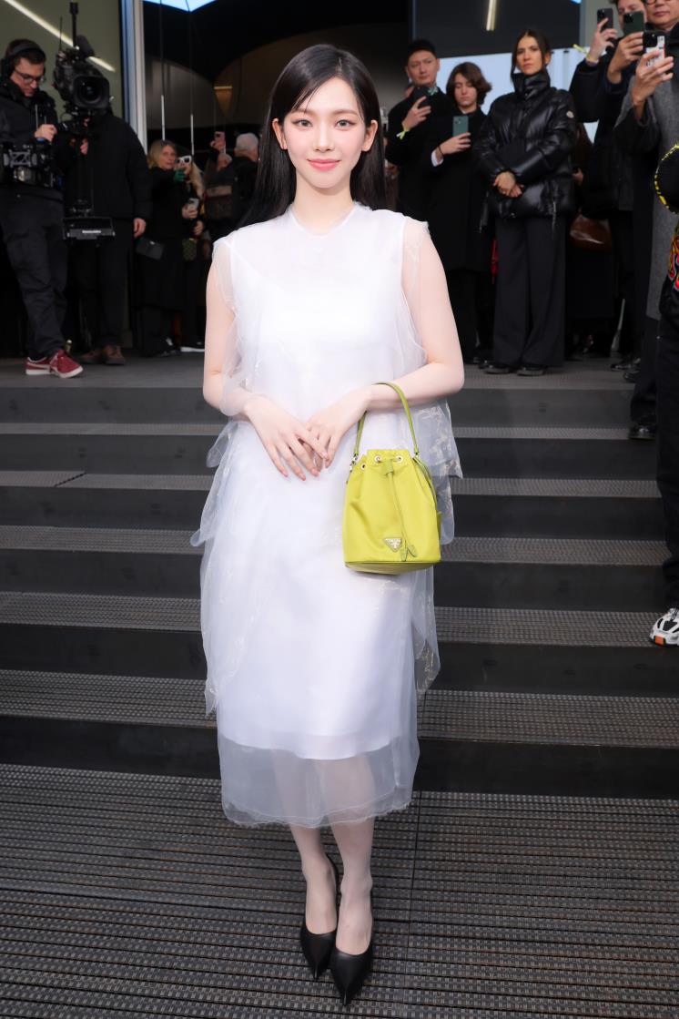 MILAN, ITALY - JANUARY 14: Yu Ji-min aka Karina arrives at the Prada fashion show during the Milan Menswear Fall/Winter 2024-2025 on January 14, 2024 in Milan, Italy. (Photo by Victor Boyko/Getty Images)