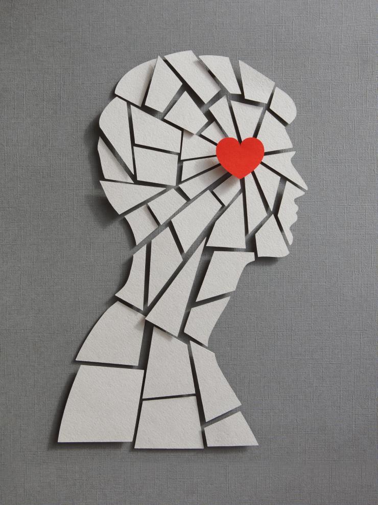 Paper craft illustration of male profile. Broken heart concept.
